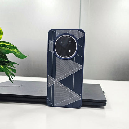 Blue geometric phone case on a white surface with a laptop and plant in the background