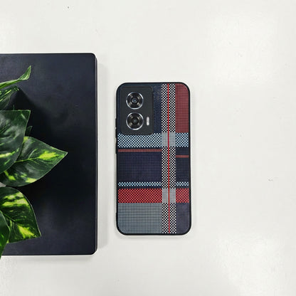 Motorola Edge 50 Fusion 5G Phone case with plaid pattern on a white surface with a plant and black book.