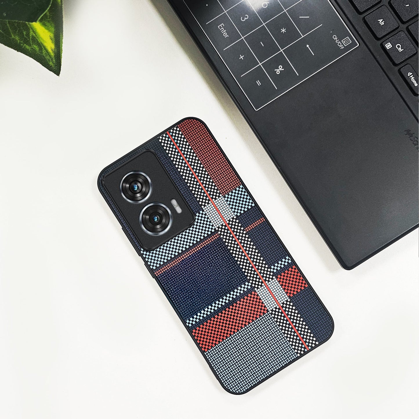 Motorola Edge 50 Fusion 5G Phone case with plaid pattern on a white surface next to a laptop