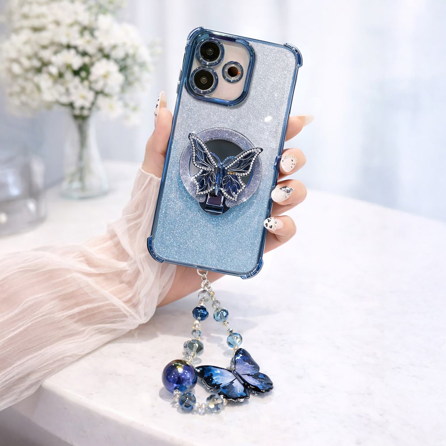 Oppo A5 Pro 5G Phone case with butterfly design and blue beads held by a hand.