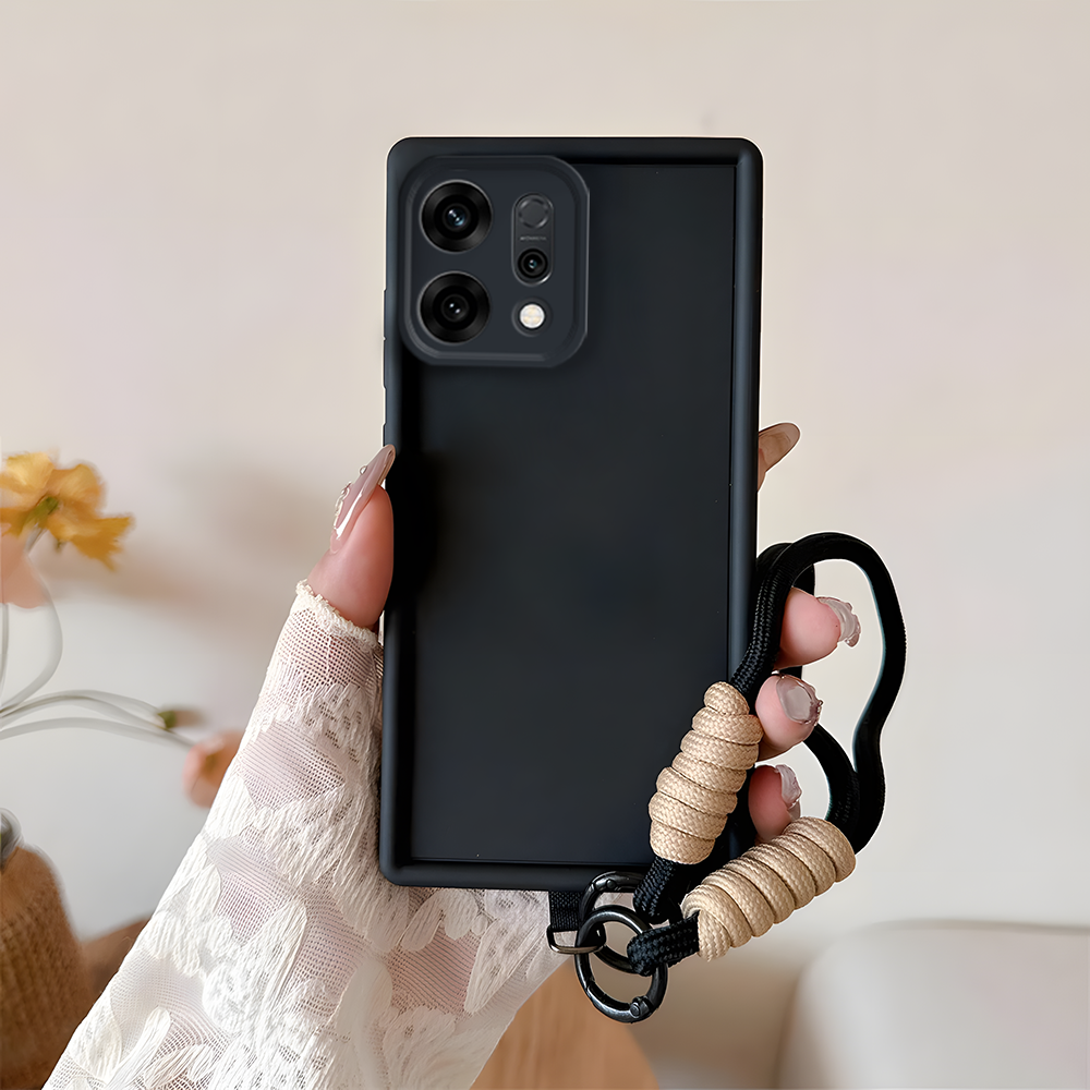 Oppo Reno 14 5G Black phone case with a beige rope handle held by a hand against a neutral background