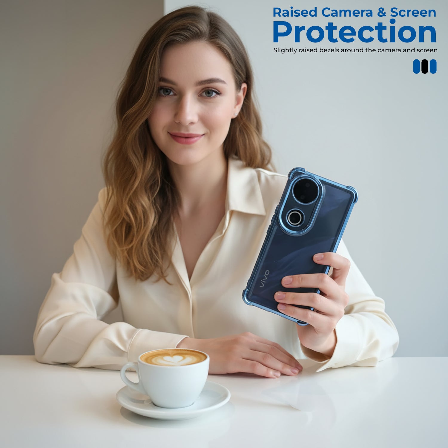 Woman holding a smartphone with raised camera and screen protection, sitting at a table with a cup of coffee.