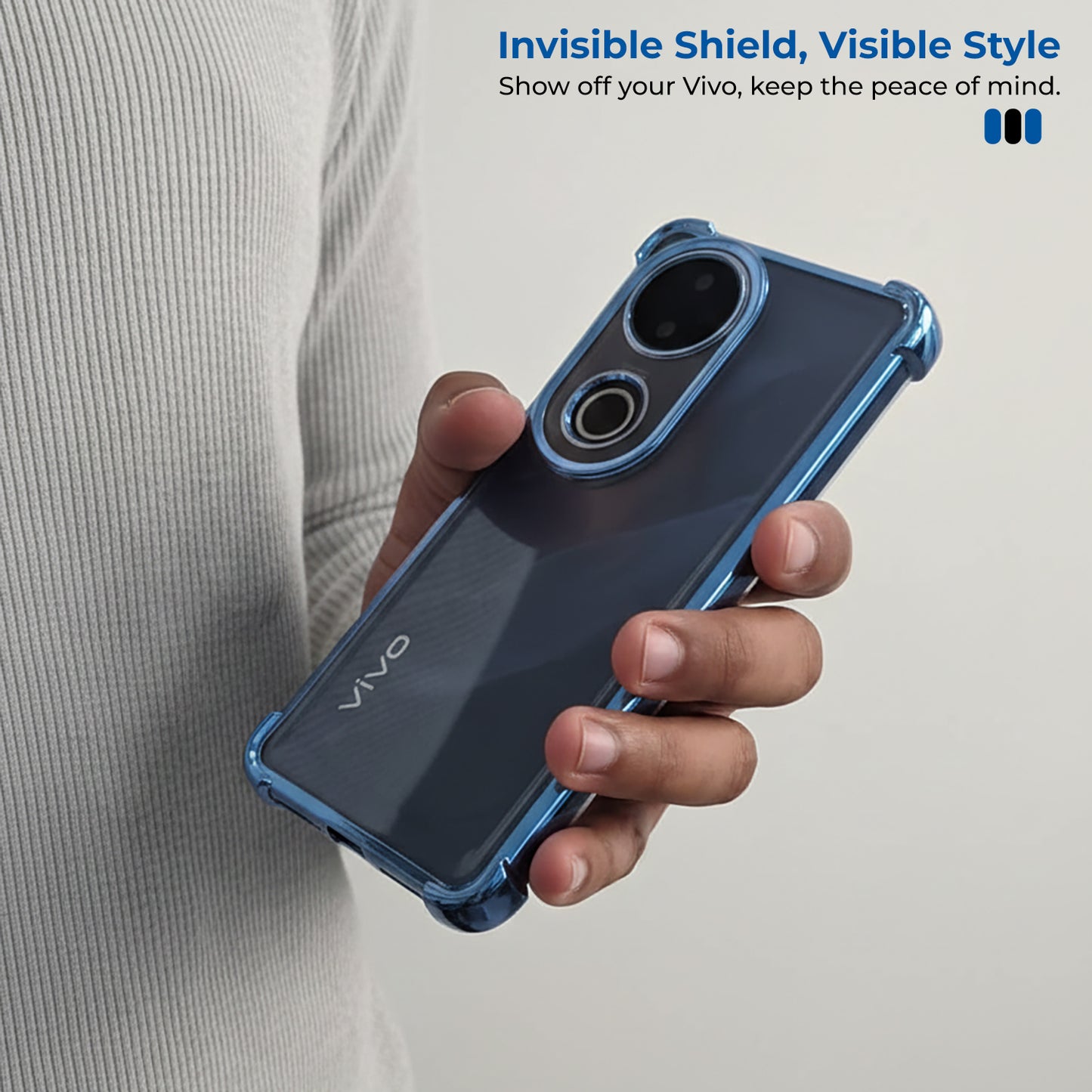 Person holding a Vivo V50 5G phone with a blue case, promotional text about 'Invisible Shield, Visible Style' on a light gray background.