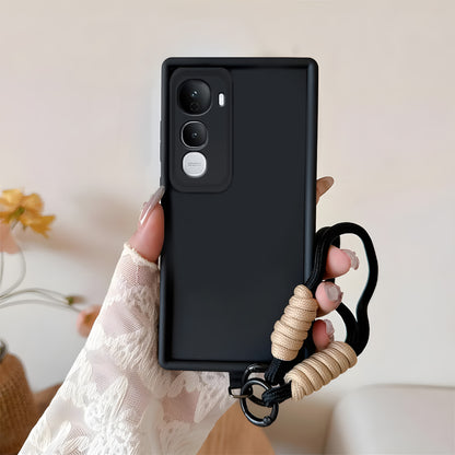 Black phone case with a beige cord held by a hand against a neutral background