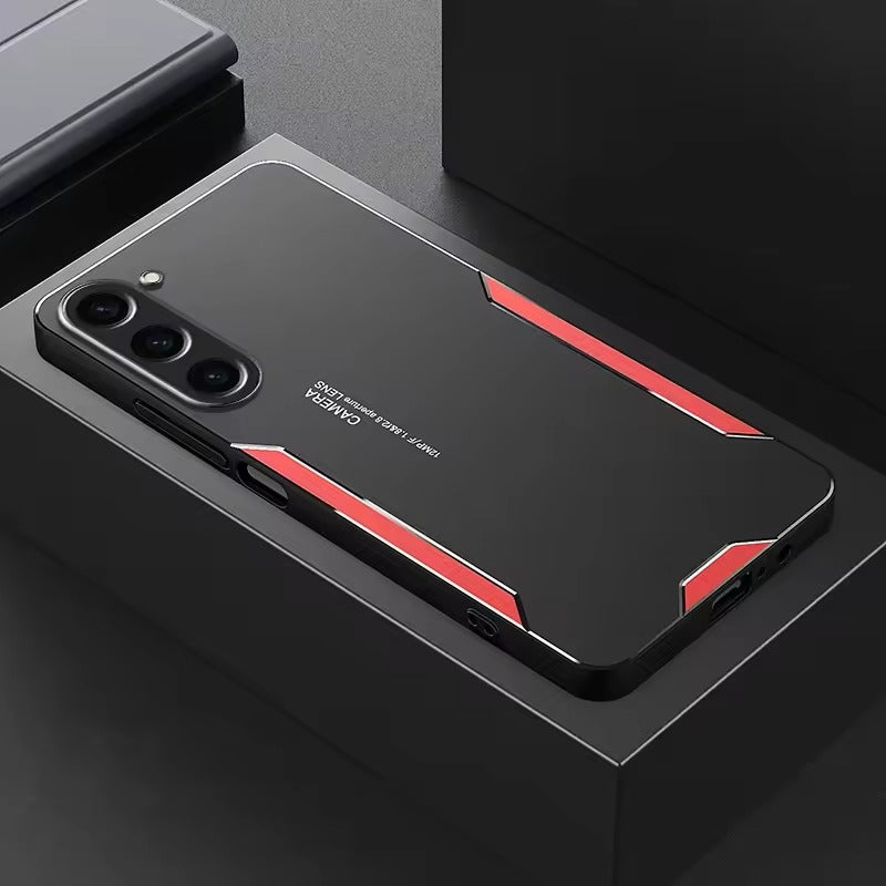 Phone case with black and red design on a dark surface
