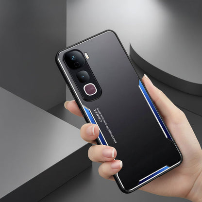 Person holding a smartphone with a reflective case against a gray background