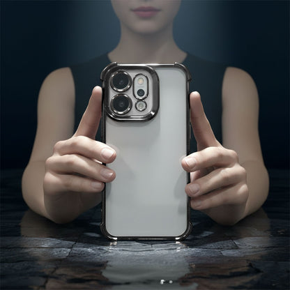 Person holding a Oppo Reno 14 5G phone with a clear case against a dark background